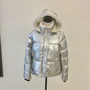 Silver puffy jacket with removable hood.